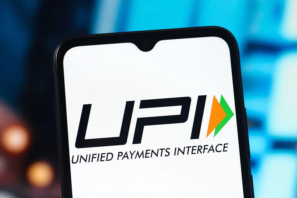 A close-up of a smartphone screen displaying the black UPI logo and "UNIFIED PAYMENTS INTERFACE".